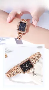Macro detail of a rose gold rectangle watch featuring a rhinestone bezel and starry dial