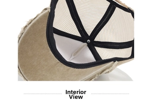 Detailed view of internal mesh cap structure with black reinforcement tape and breathable mesh
