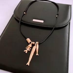 Minimalist long fishbone pendant necklace with adjustable black leather cord
