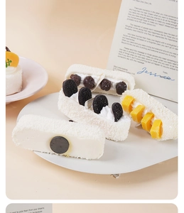 Detailed view of artificial PU foam cake magnets with mango and berry toppings decoration