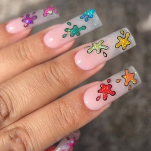 Detail of pink gradient press-on nails with holographic glitter and marble texture effects