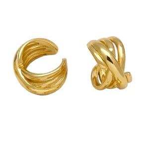Gold double-layered crisscross ear cuff earrings with a minimalist spiral wrap design