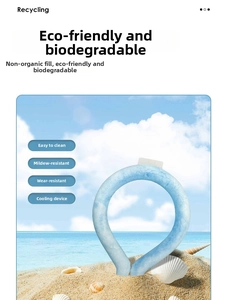 Detailed view of light blue PCM cooling neck ring with ice texture on summer beach background