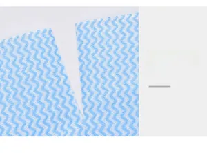 Macro view of blue and white wave patterned disposable cleaning cloth with easy tear perforation