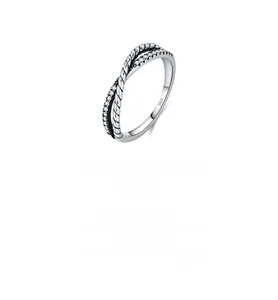 Macro shot of 925 sterling silver ring showing twisted texture and zircon inlay