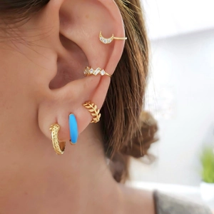 Mix of gold-plated hoop earrings with blue enamel and sparkling zircon accents for women