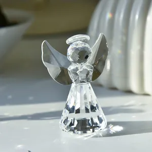 Polished crystal angel figurine with star detail showing rainbow light refraction