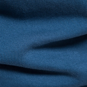 Detailed close-up of dark teal knit fabric texture on a long sleeve Henley sweater
