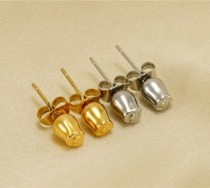 Detailed close-up of tulip bud earrings in polished gold and silver stainless steel