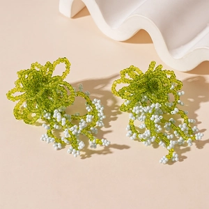Handmade green and white beaded floral fringe earrings with delicate tassels