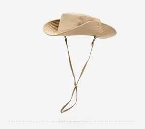 Detail view of khaki outdoor sun hat featuring wide brim with metal buttons and chin strap