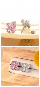 Detailed view of pink heart-shaped clover earrings with secure screw back posts