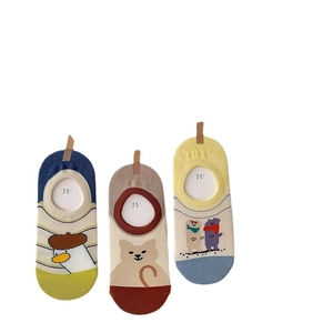 Set of three colorful cotton no-show socks featuring cartoon animal patterns on white base