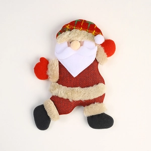 Detail of Santa Claus fabric ornament with plaid hat and rustic burlap texture