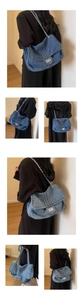 Detail of vintage blue denim tote bag with silver chain strap and metallic square lock