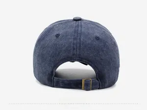 Detail of adjustable metal buckle and washed denim texture on vintage baseball cap back