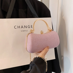 Elegant pink glitter evening bag with rhinestone handle and gold metal chain strap