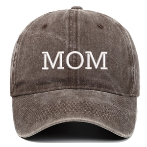 Detailed view of white MOM embroidery on washed cotton vintage baseball cap crown