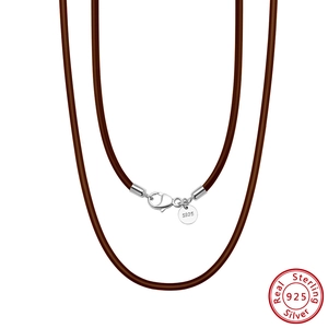 Detail of 925 sterling silver lobster clasp on brown leather necklace cord