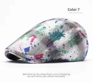 Detailed close-up of American tie-dye plaid flat cap with vibrant paint splatter art