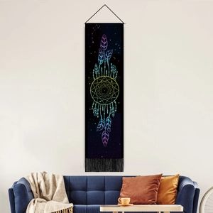 Detailed tapestry with rainbow dreamcatcher and feathers over sofa in a cozy living room