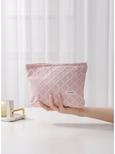 Borsa da trucco in tela rosa con motivo a griglia bianca e chiusura a cerniera