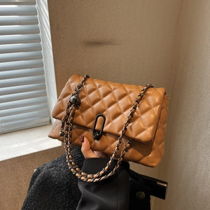 Chic brown quilted crossbody bag with dark grey chain strap and oval lock detail