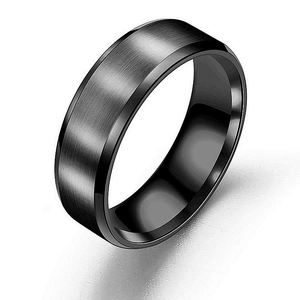 Close-up detail of a men's black titanium steel ring with a brushed matte finish