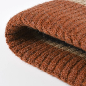Thick ribbed knit beanie featuring brown and khaki striped jacquard pattern for winter
