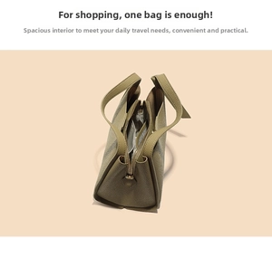 Detailed interior of leather bucket bag showing compartments and litchi texture