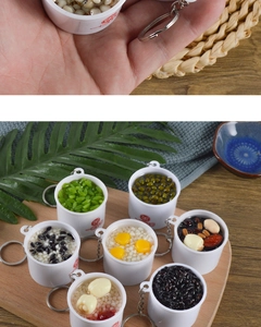 Detailed close-up of mixed artificial porridge bowl keychains with realistic food textures
