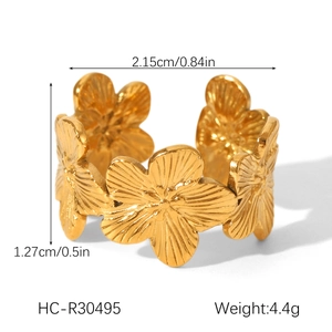 Macro view of gold-plated stainless steel flower ring with detailed size measurements