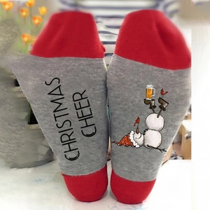 Red and grey Christmas crew socks featuring snowman graphic and festive text print