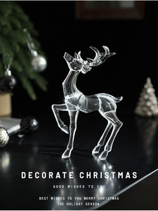 Close-up of transparent acrylic Christmas reindeer ornament with light refraction effect