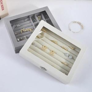 Velvet jewelry box with glass window for rings and earrings in grey and cream white