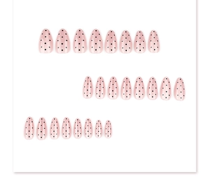 Detail of 24pcs nude cat-eye press-on nails with black polka dots in almond shape