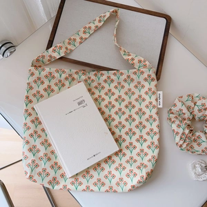 Floral cotton tote bag with vintage orange prints including matching hair accessories