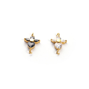 Macro shot of gold DIY flower pendant charms with black and white cubic zirconia