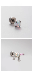 Macro shot of titanium steel heart opal stud earring with pink zircon star pendant