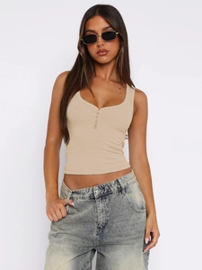 Detail of beige ribbed tank top featuring deep U-neckline and functional buttons