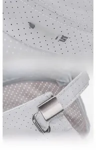 Detail of grey sports cap with laser-cut mesh fabric and metal adjustment buckle