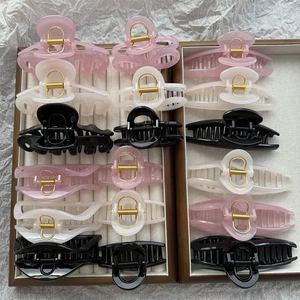 Assorted jelly color hair clips set in pink, white, and black tones for women