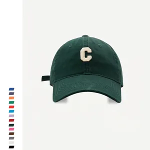 Dark green baseball cap with white 3D embroidered C letter in premium cotton twill