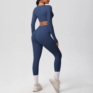 Detail of dark blue yoga set showing high waist leggings with functional side pockets