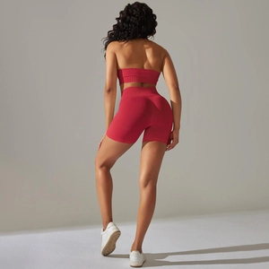 Macro shot of seamless bright red yoga set showing ribbed texture and high waist detail