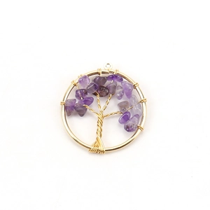 Detail of Tree of Life pendant with purple amethyst stones and golden wire wrapping