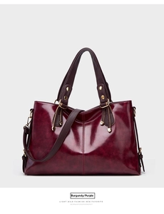 Detailed view of the women leather shoulder handbag, showing fine texture and metal hardware.