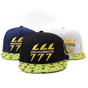 Close-up of hip-hop baseball caps in black, navy, and grey with custom lightning embroidery
