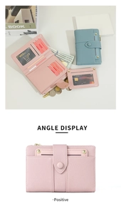 Detail view of pink and blue bifold wallets with multi-card slots and coin pocket