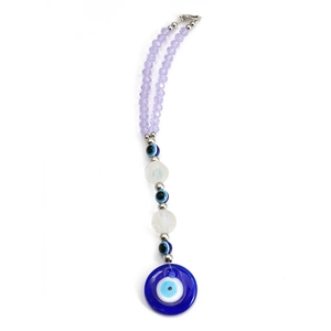 Macro detail of Evil Eye glass pendant with purple faceted beads and lobster clasp